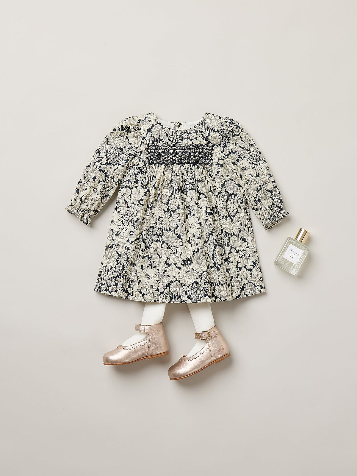 Jailys baby dress in Liberty fabric with smocking and hand embroidery in organic cotton