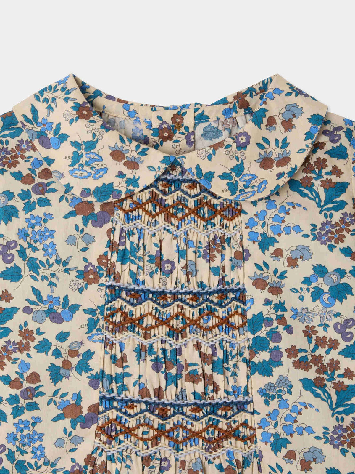 Missi baby blouse in Liberty fabric with smocking and hand embroidery in organic cotton